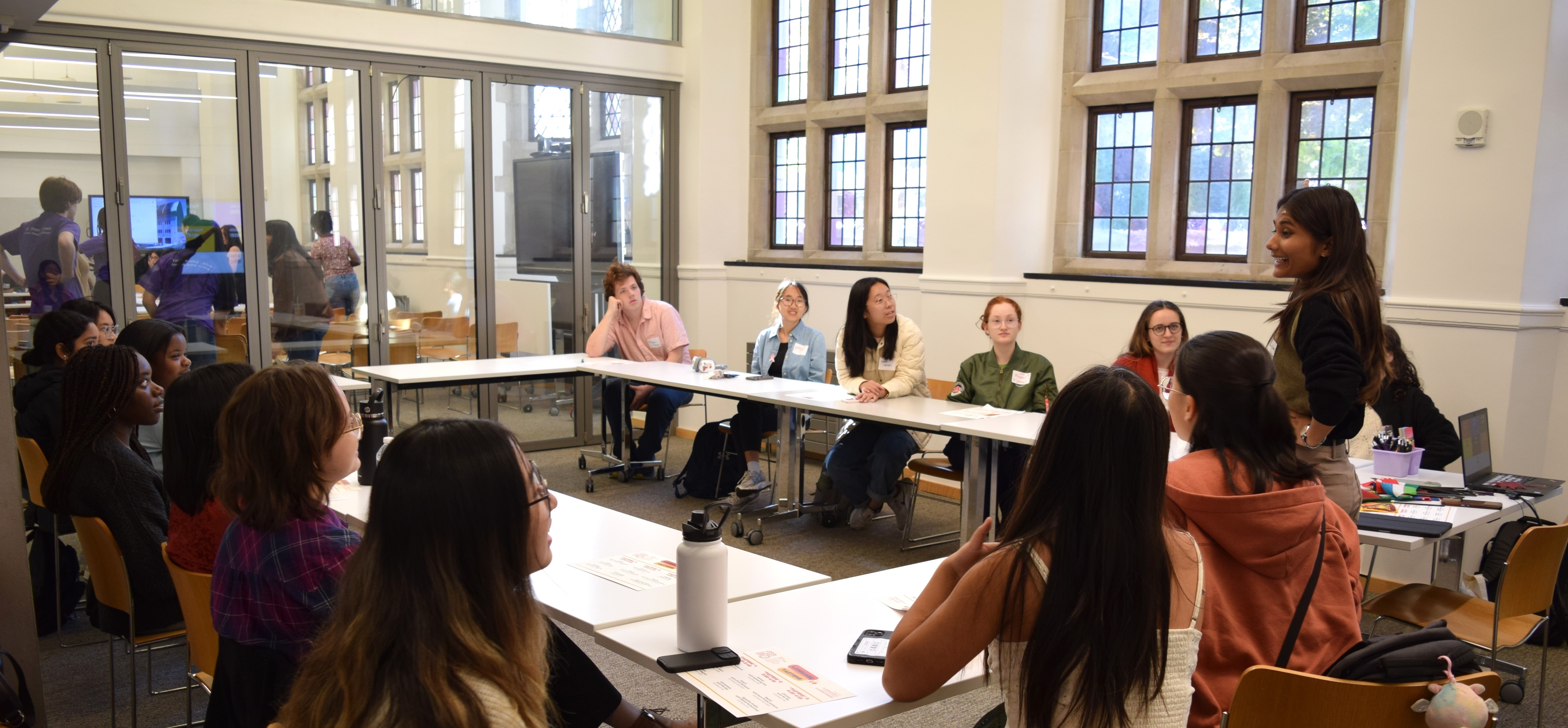 An instructor leads a class of students in a Poorvu Center classroom.