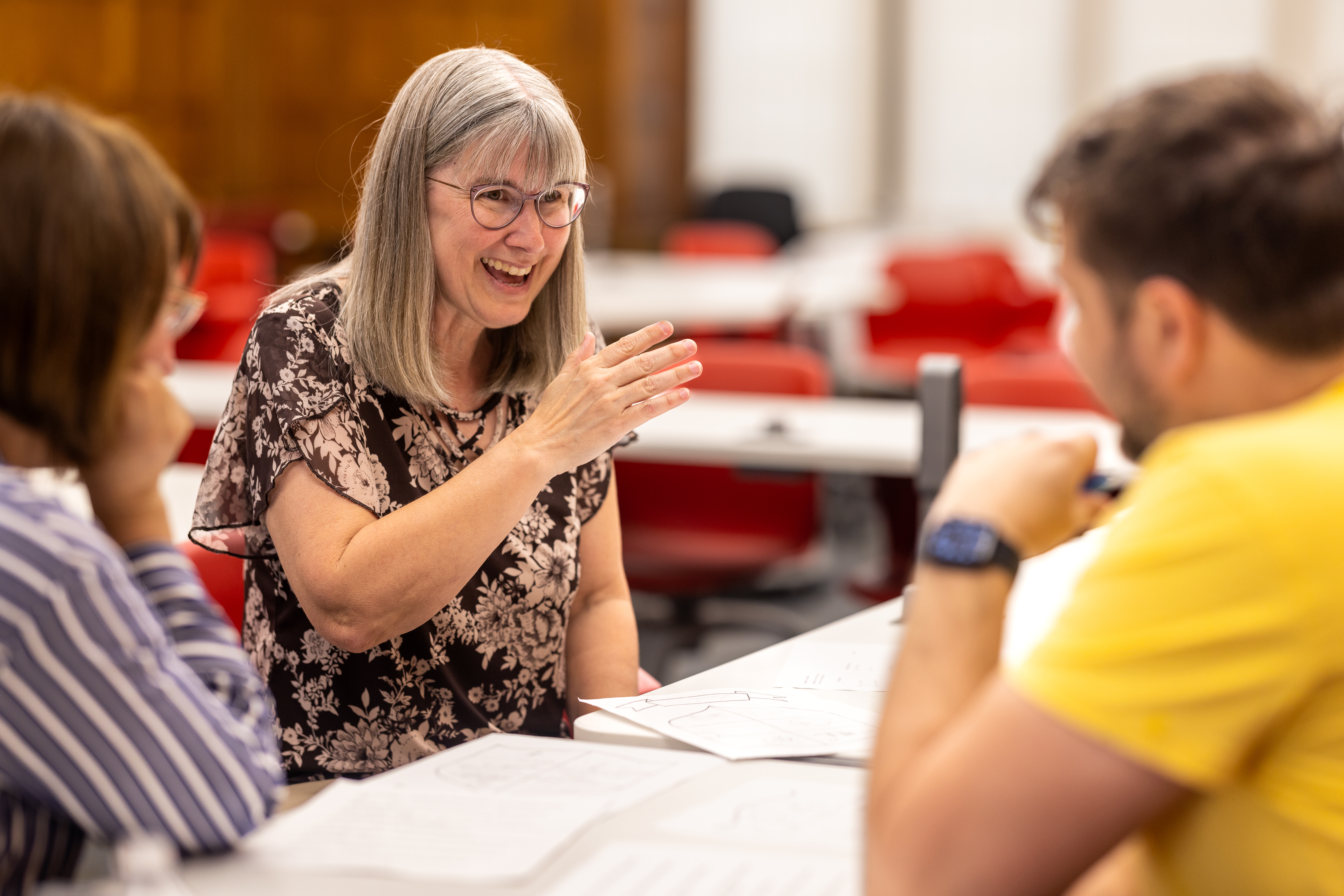Teachers talking across a table