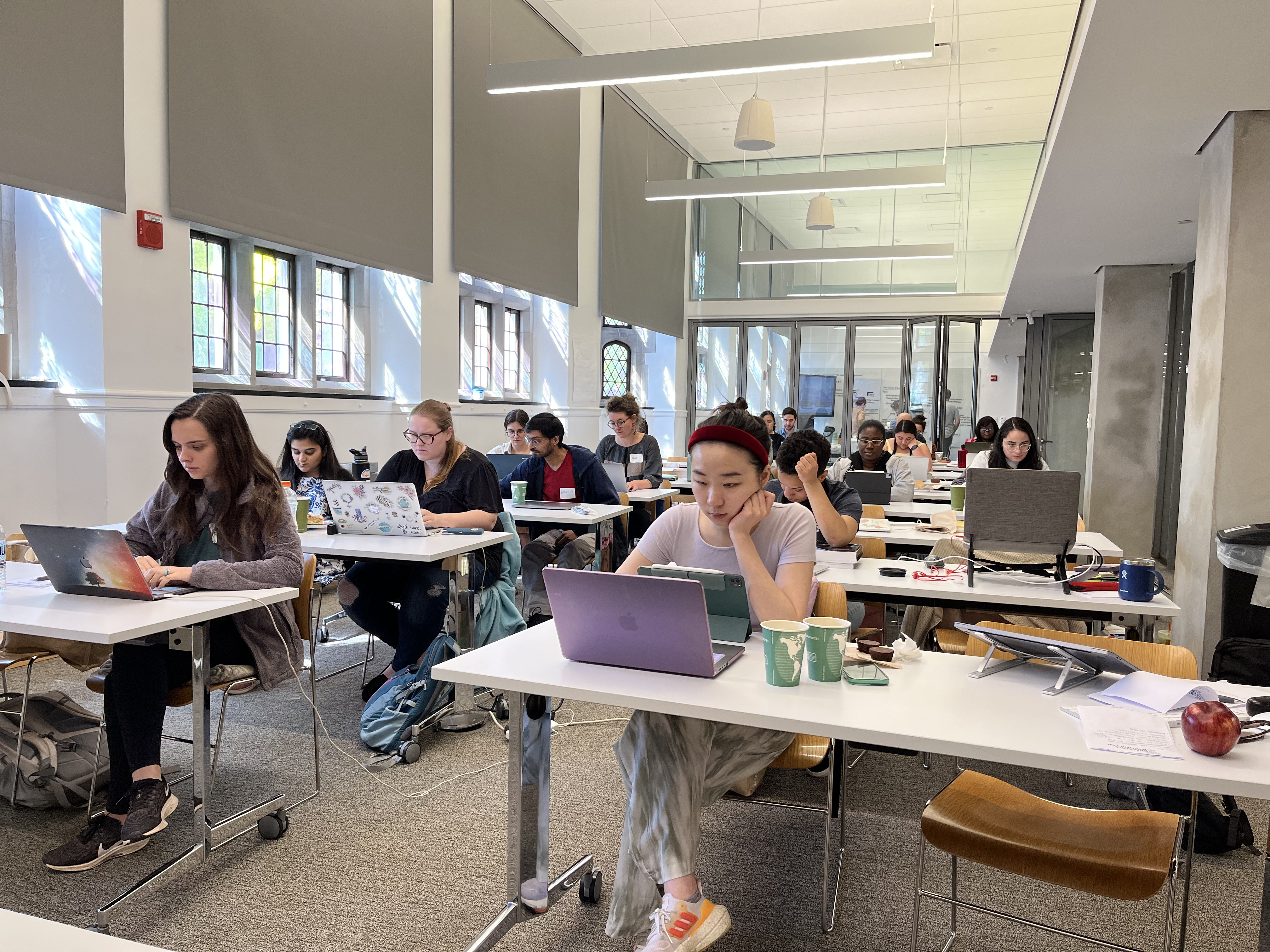Graduate students writing together at an All Write event in the Poorvu Center