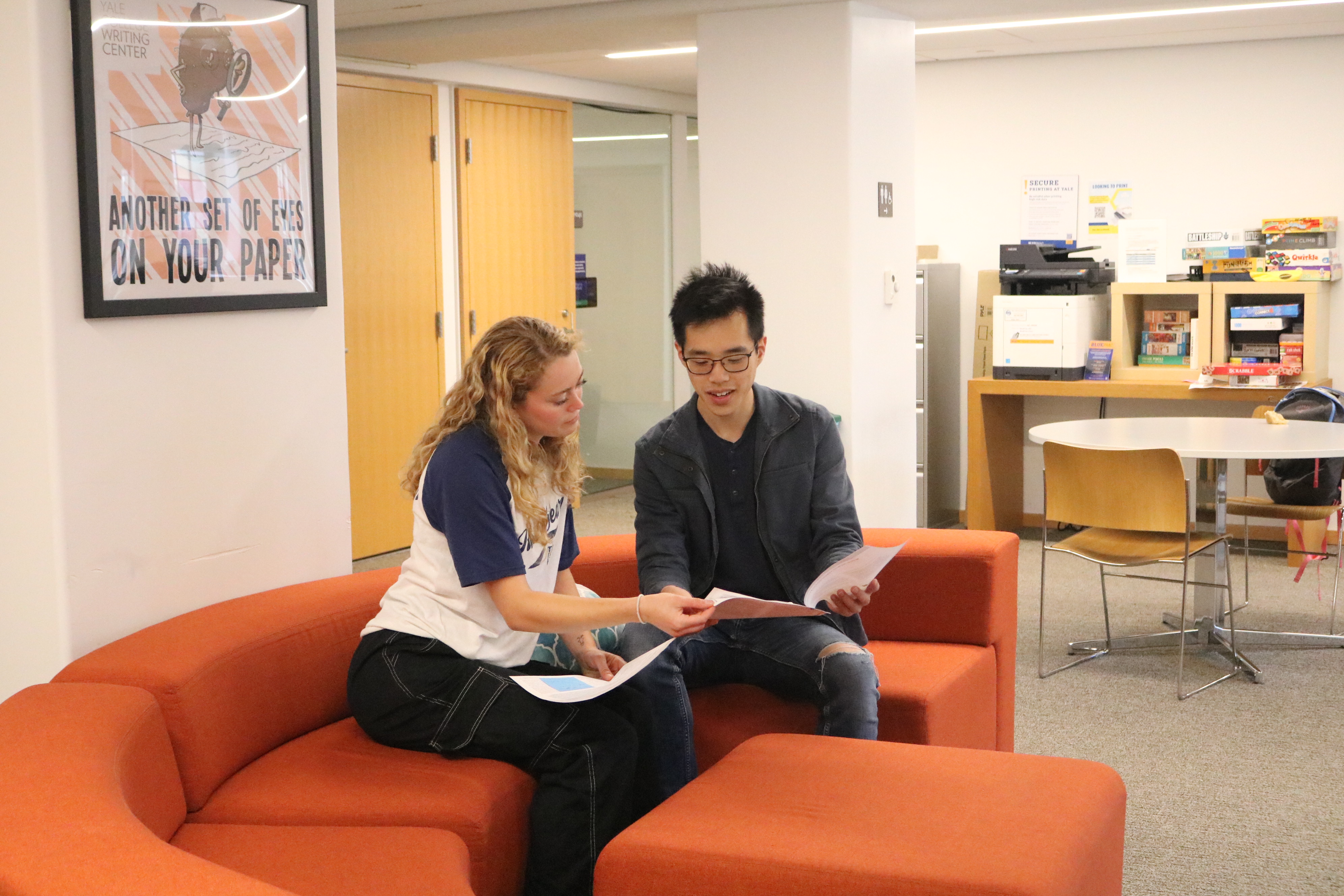 A Graduate Writing Lab Fellow giving a writer 1–1 feedback in the Poorvu Center.