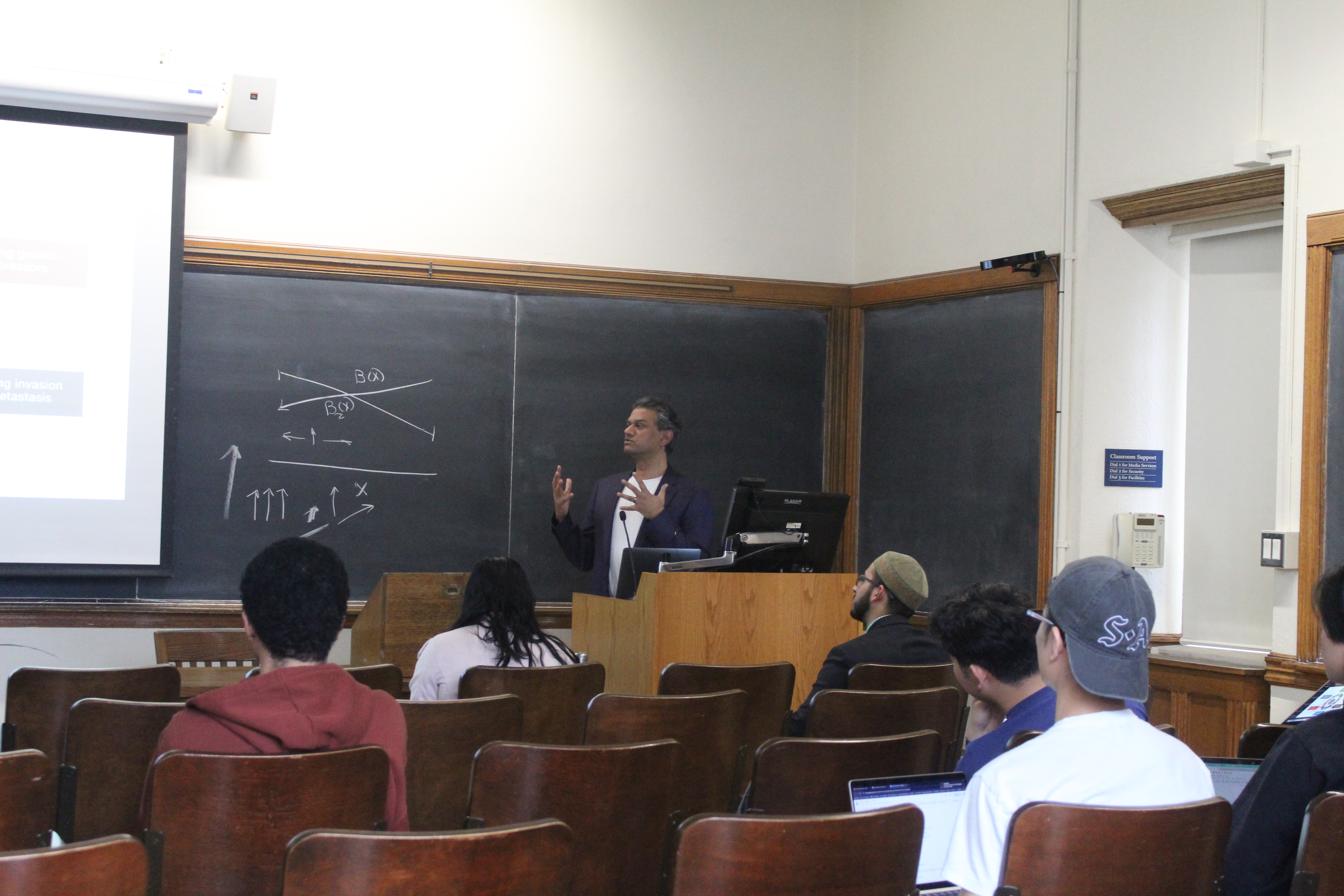 Instructor lecturing a class of students