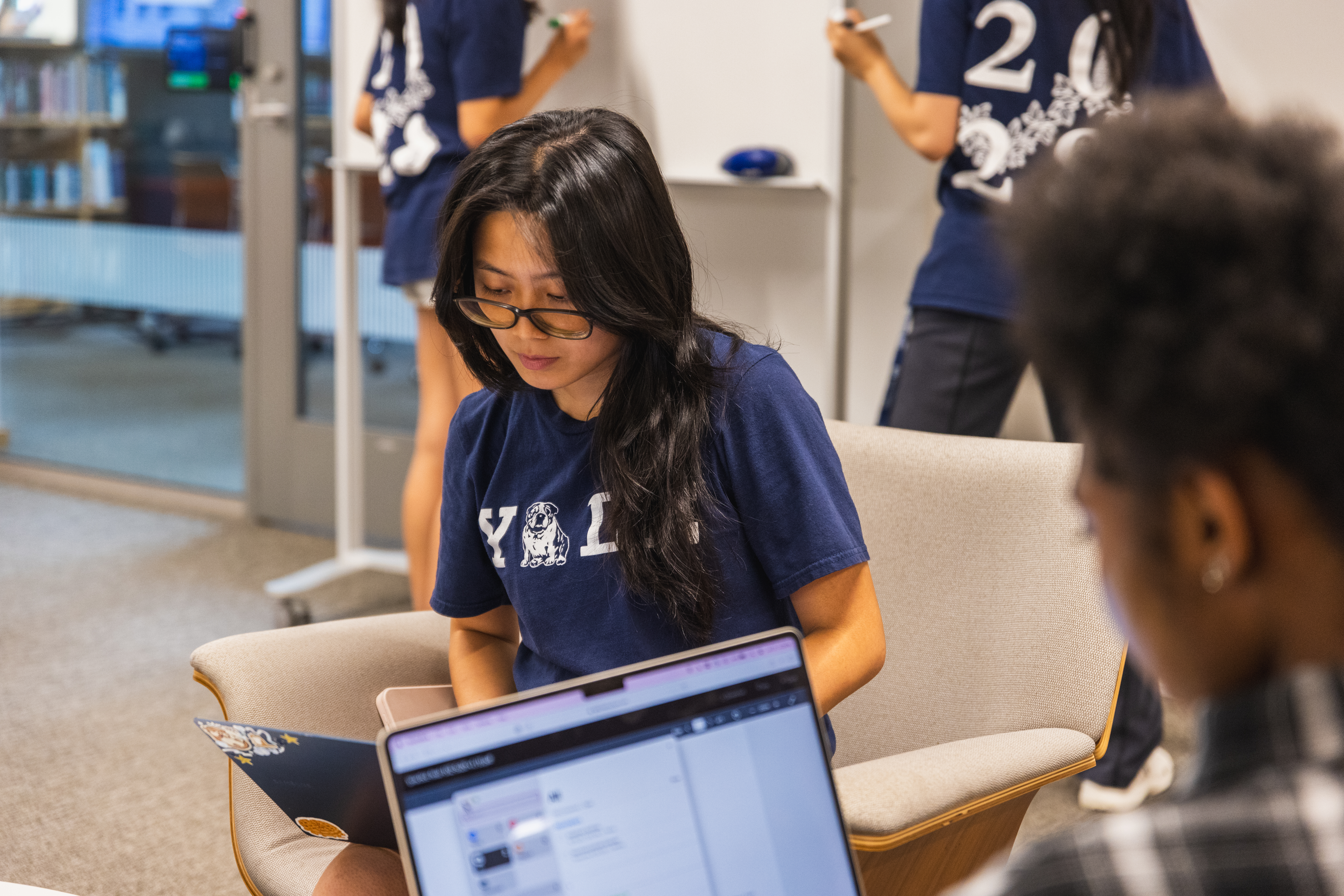 Two students working in the student lounge