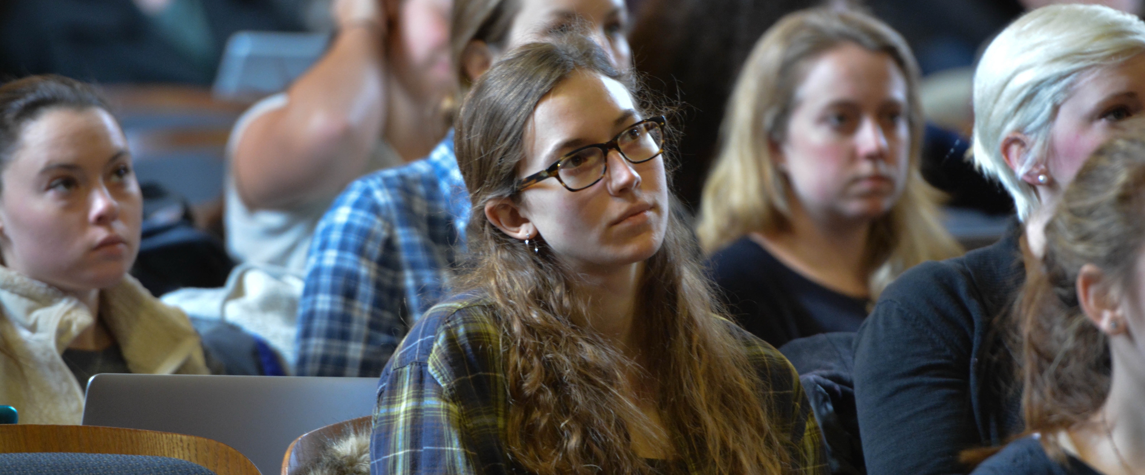 female student in large lecture hall