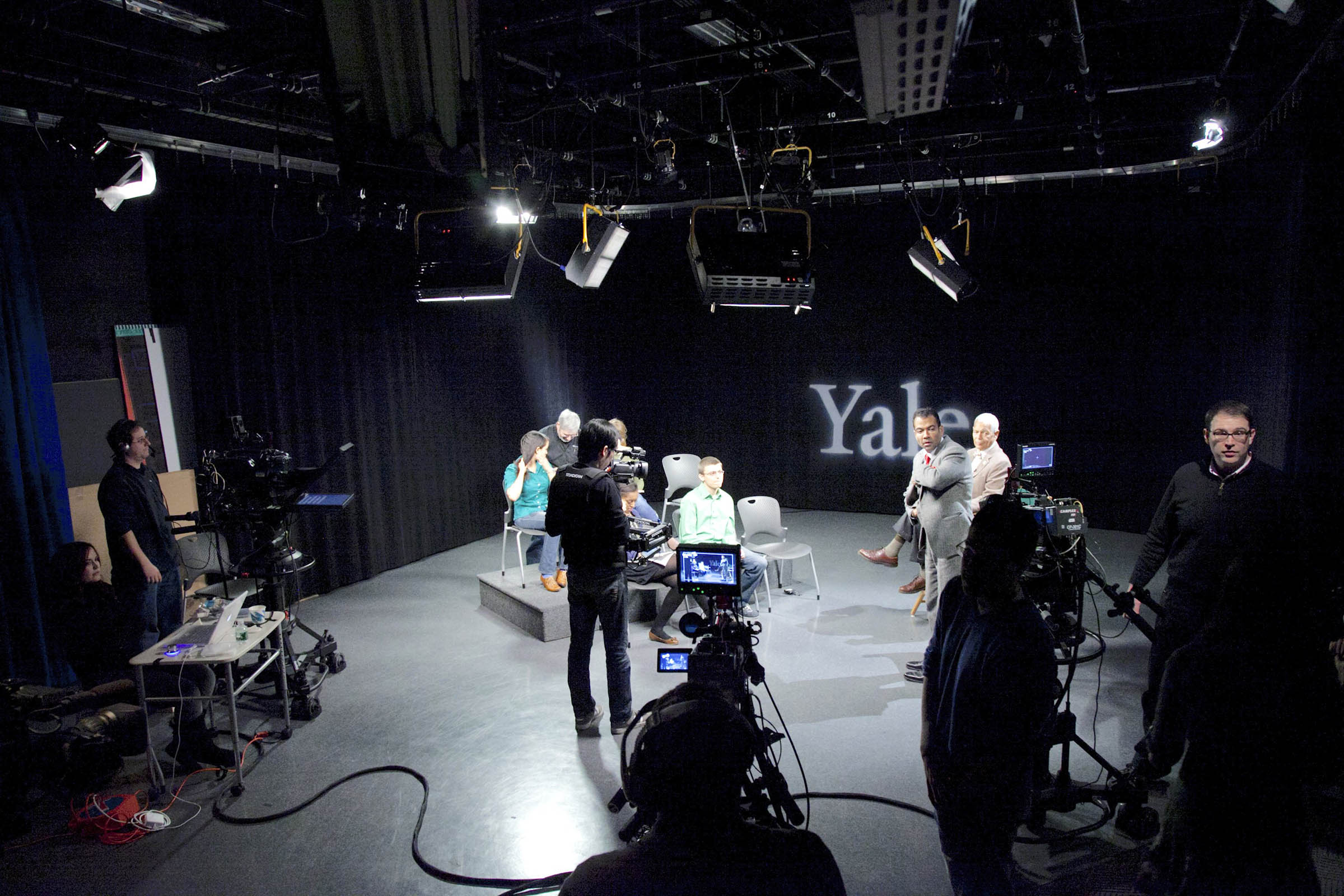 Yale Broadcast studio with various people on set.