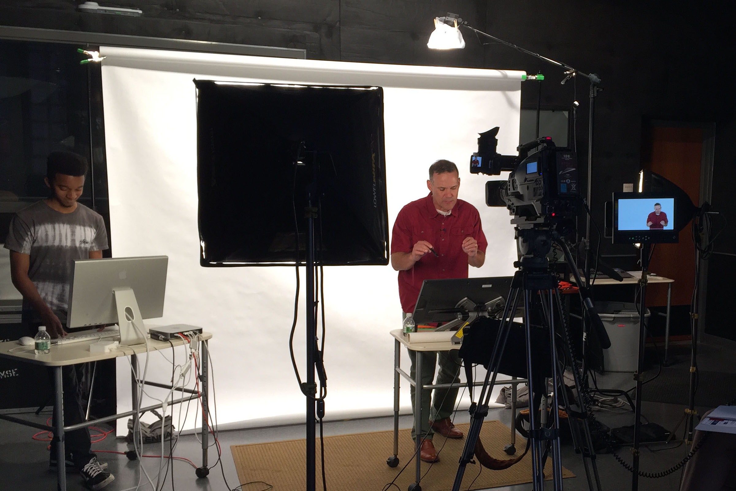 Professor teaching in studio recording setting