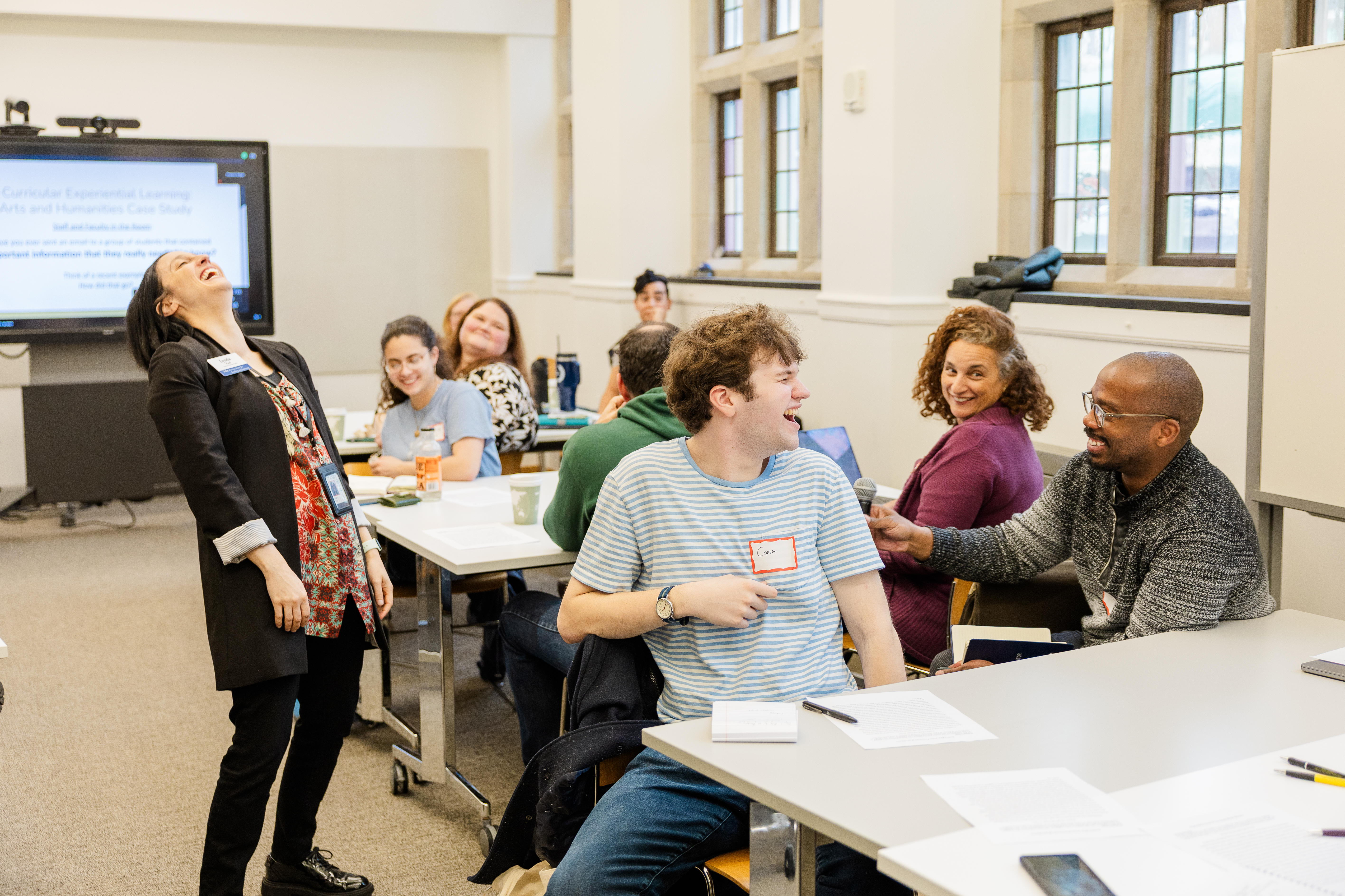 Lynda Paul laughs at comment offered by audience member at event discussing asset based approaches to learning