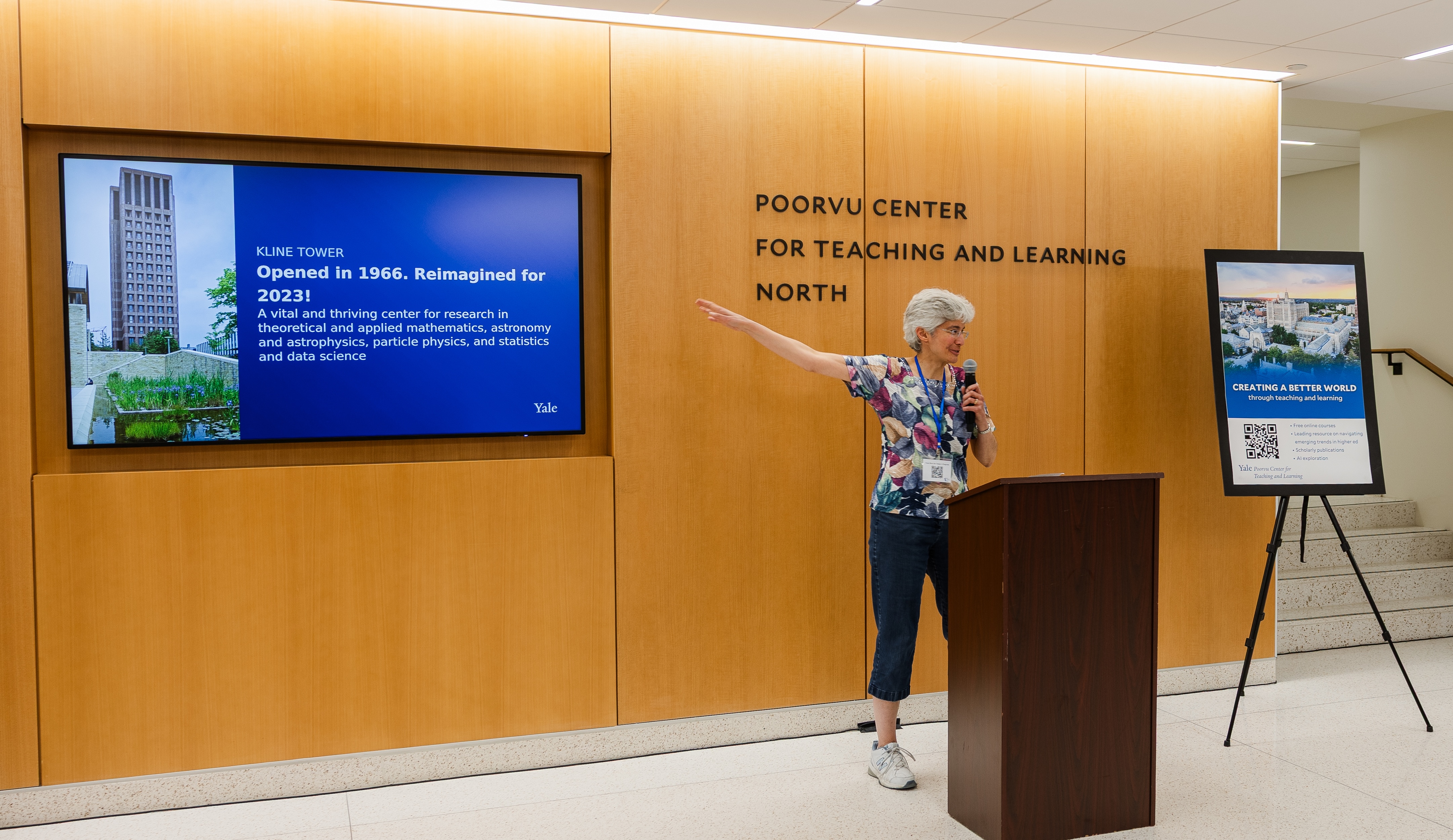 Beth Bennet points to a screen she uses to display content during her speech at the opening reception of Poorvu North