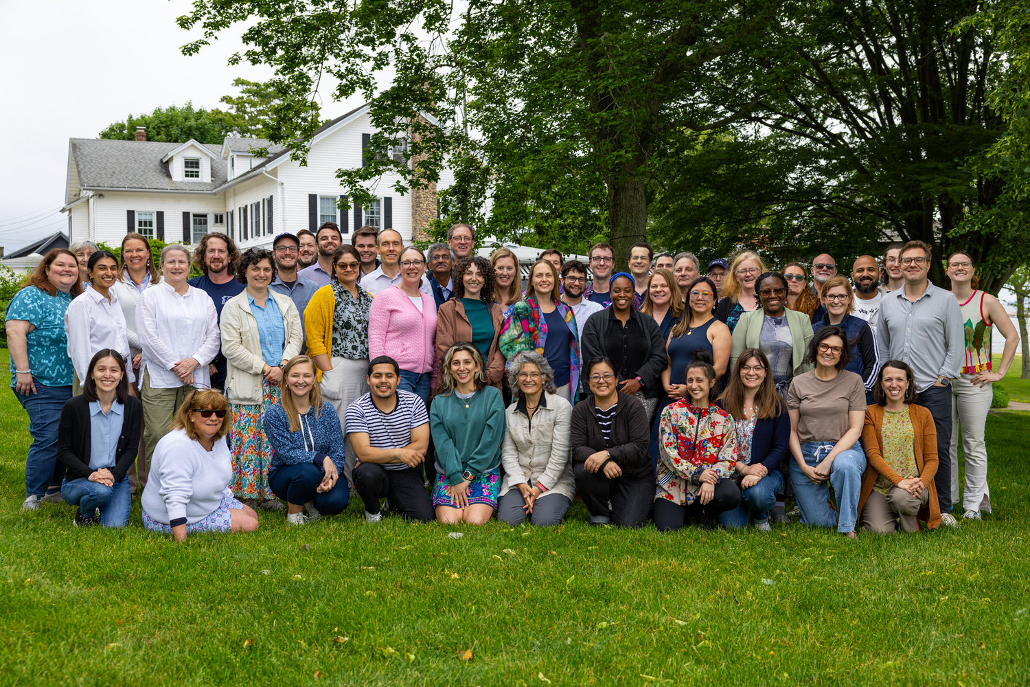 Poorvu Center staff standing together on a lawn.