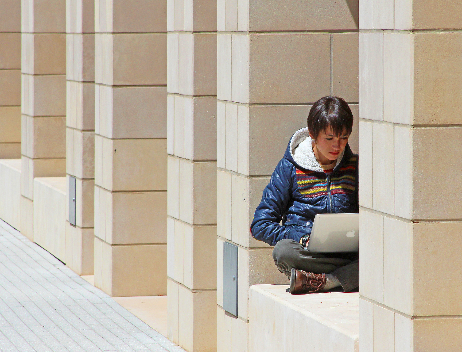 Person sitting with a laptop