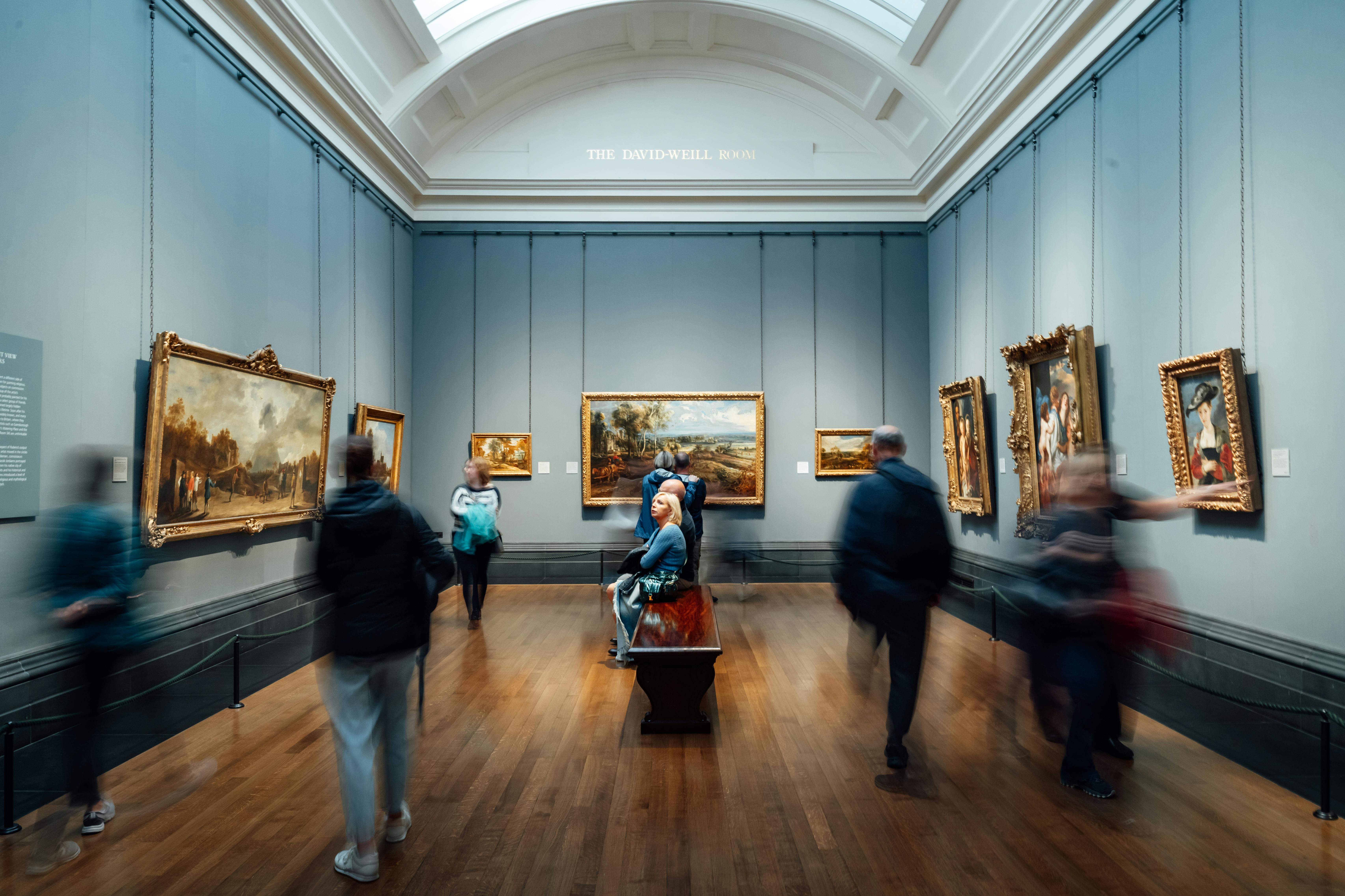 people looking at art in a museum 