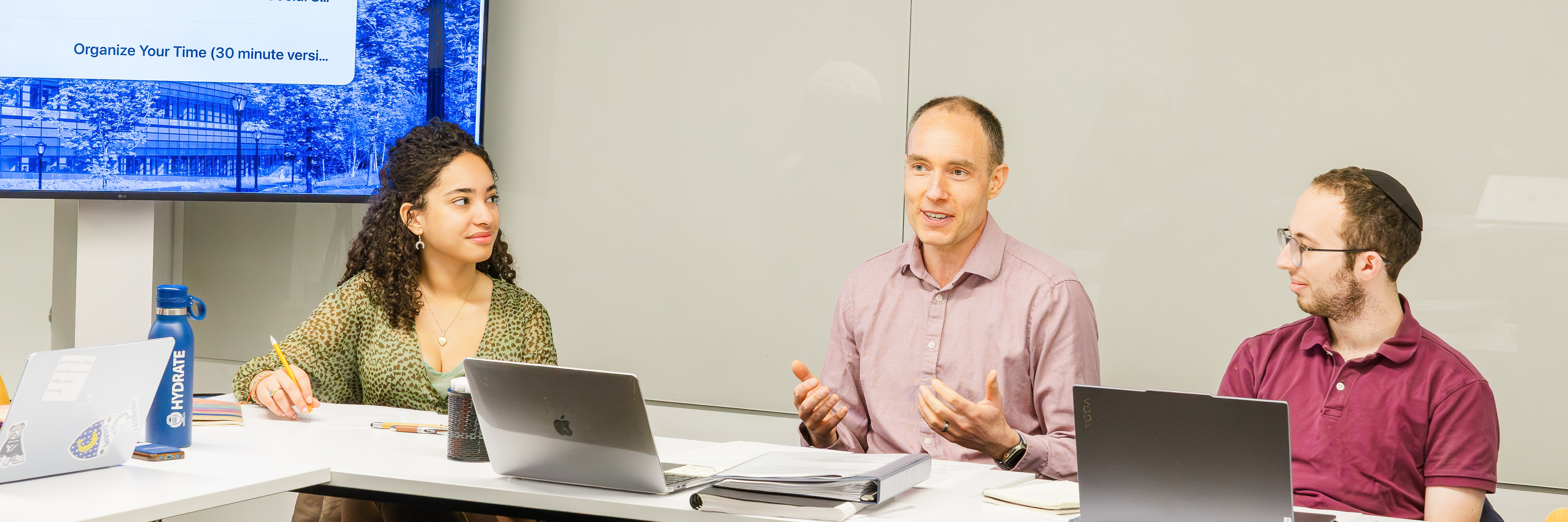 A facilitator leads a GWL peer-review group.