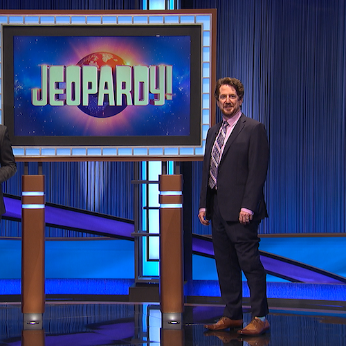 Alfred Guy stands on the stage of the TV show Jeopardy