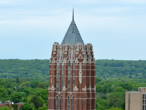 Yale Poorvu Center works with the GSAS for the Associates in Teaching Program. An image of the GSAS tower with West Rock.