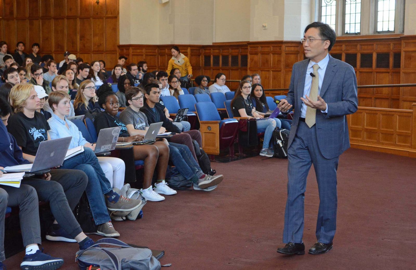 Dean Marvin Chun stands in a lecture hall with hundreds of students to teach his Intro to Psychology course
