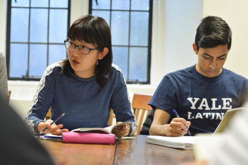 Two students, one female and one male, in a classroom.