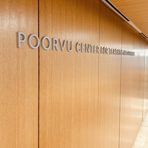 The sign behind the front desk reads Poorvu Center for Teaching and Learning