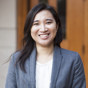Ardina Hasanbasri is a woman wearing a blue suit jacket and white shirt.