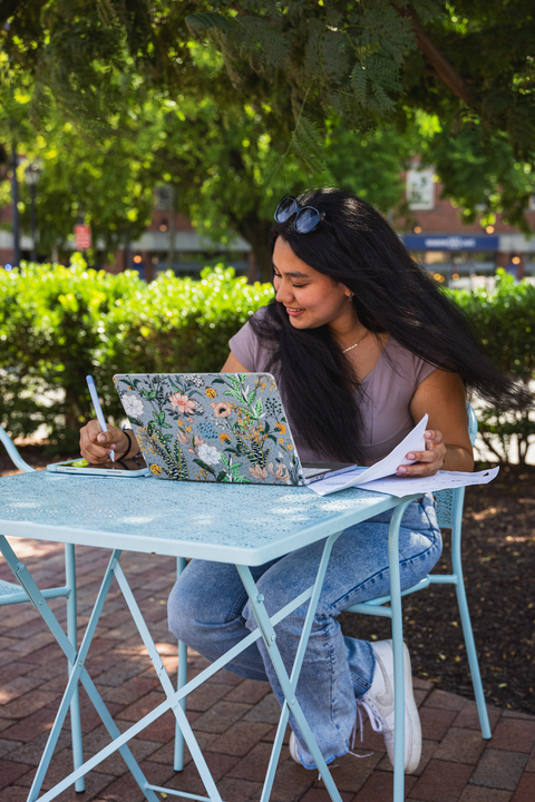 Young Woman studies outside