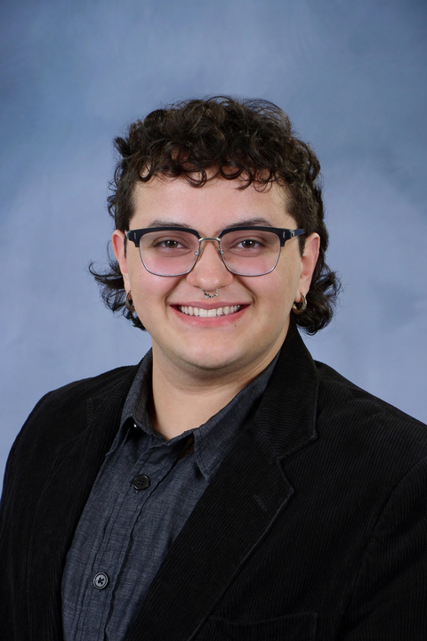 headshot of adrian