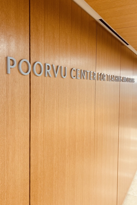 The sign behind the front desk reads Poorvu Center for Teaching and Learning