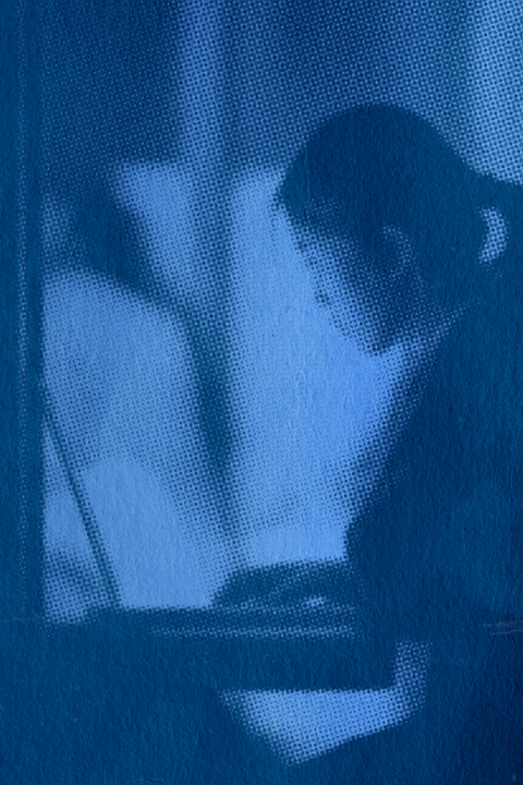 a student reviewing their assignments on their laptop in the library
