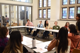 An instructor leads a class of students in a Poorvu Center classroom.