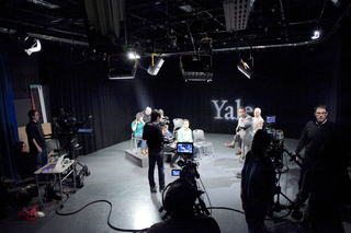Yale Broadcast studio with various people on set.