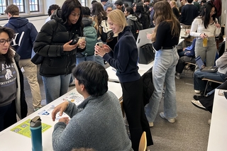 Students gather together during symposium event.