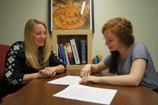 Students write together.