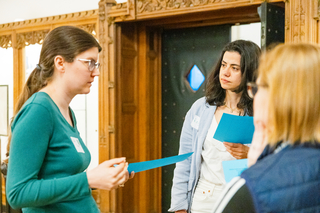 Instructors standing to discuss activity during Course (Re)Design.