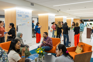 Guests mingling in the concourse area of Poorvu North in Kline Tower
