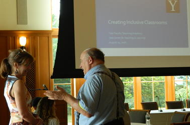 New faculty with Nancy Nancy Niemi in conversation with a new faculty member at the Greenberg Center