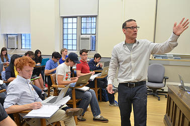 James Rolf teaches a class of students at Yale