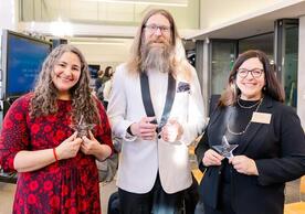 From left to right, Dr. Laurie Santos, Dr. Michael Wininger, and Dr. Eva Garen receiving Yaliewood Honors