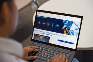 Man works on laptop