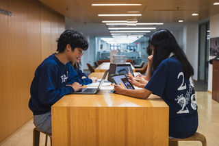 Students working at a high top table
