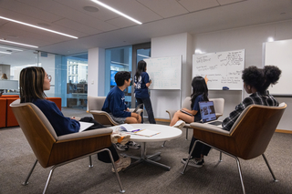 Group of students learning from each other