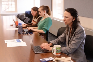 Faculty work independently during AI Coffee Talk.
