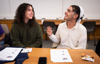 Two people are talking to each other and having fun.