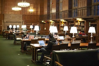 Students writing in Starr Reading Room in Yale's Sterling Library