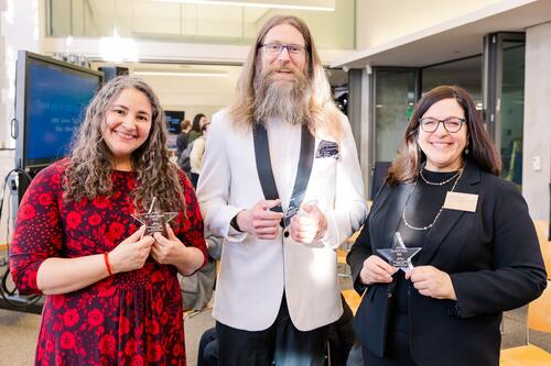 From left to right, Dr. Laurie Santos, Dr. Michael Wininger, and Dr. Eva Garen receiving Yaliewood Honors